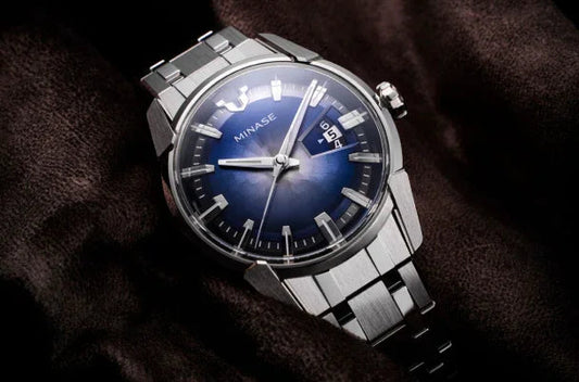 MINASE blue mechanical stainless-steel logo