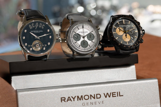 Three RAYMOND WEIL Swiss mechanical watches including an AC/DC edition, chronograph and black-dial model