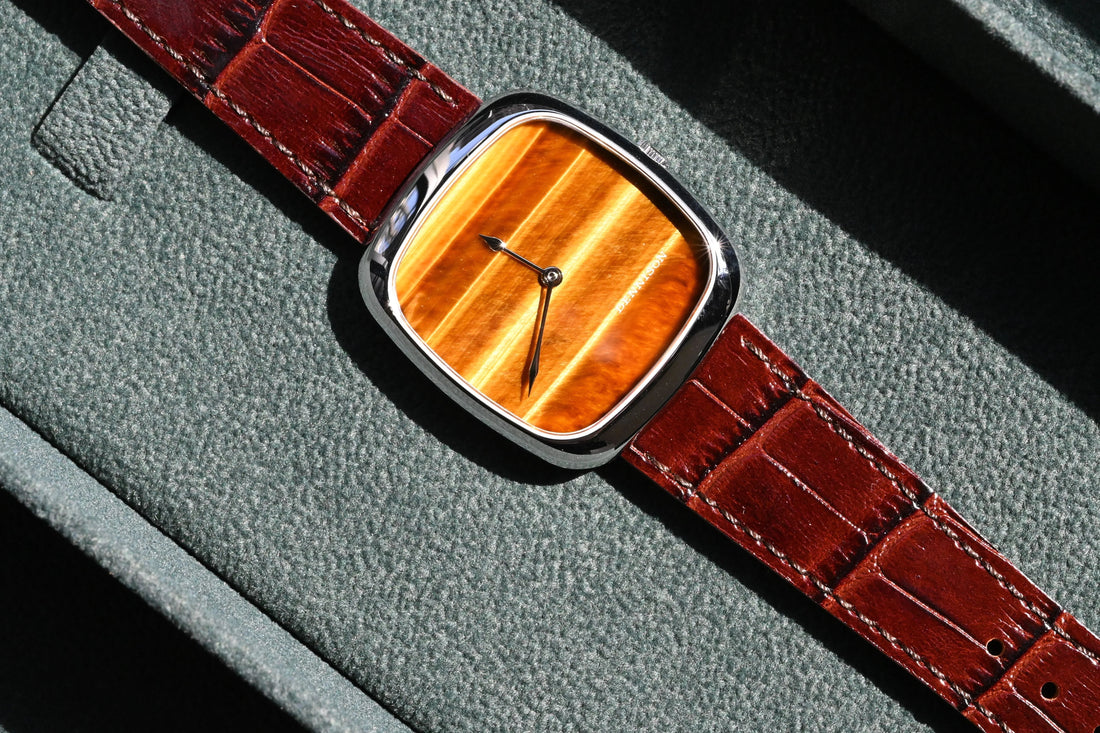 Silver red brown leather watch from CONTÉVANOU