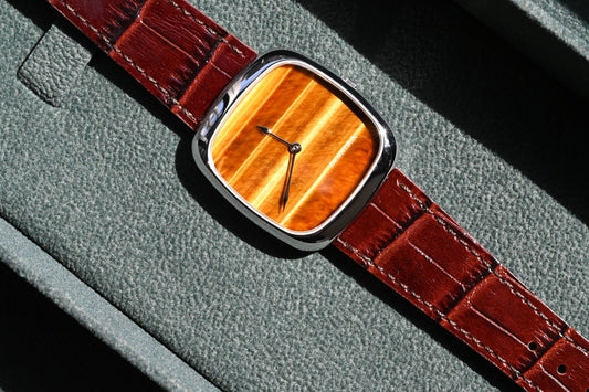 Silver red brown leather watch from CONTÉVANOU