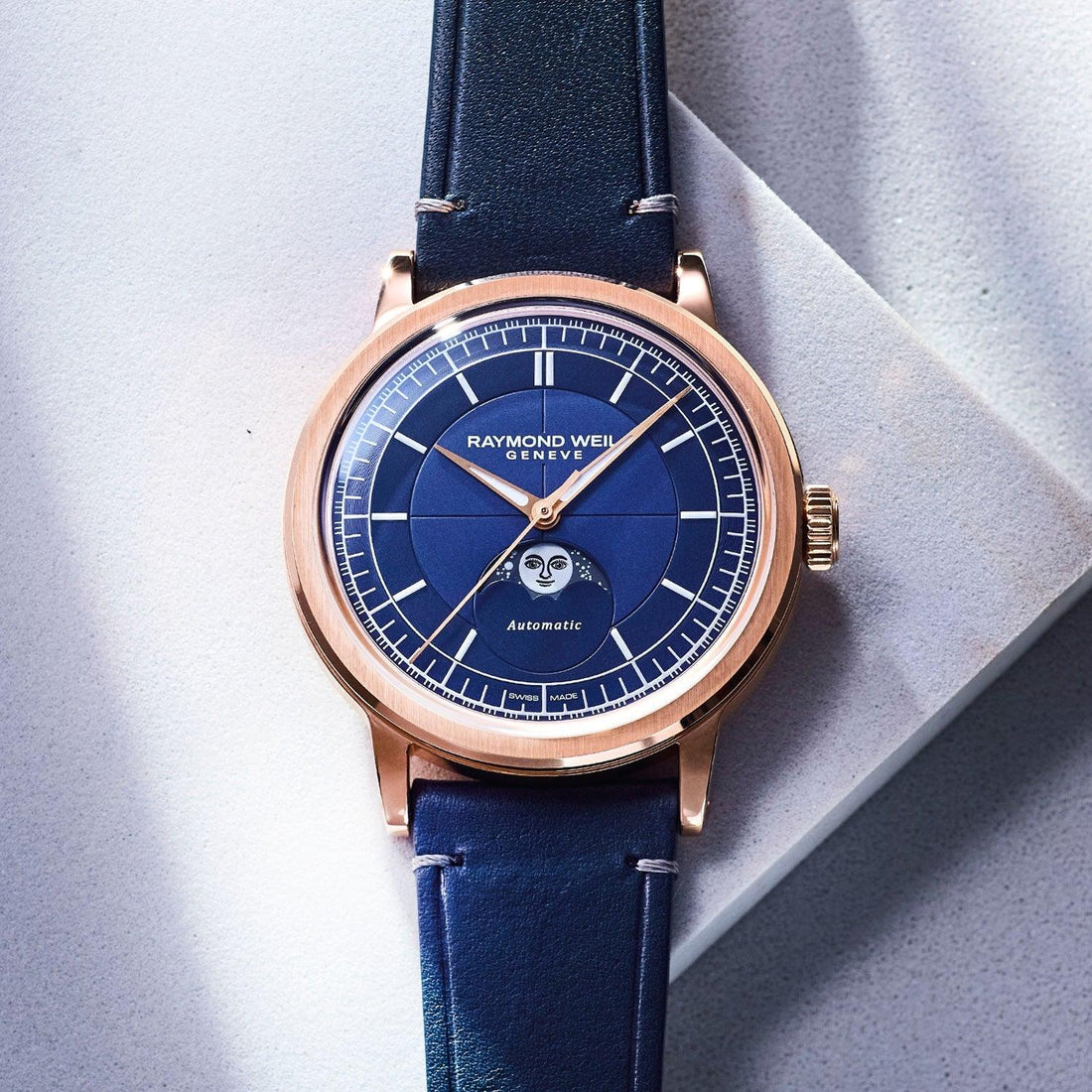 RAYMOND WEIL automatic watch with blue moon-phase dial, rose gold-tone case and navy leather strap