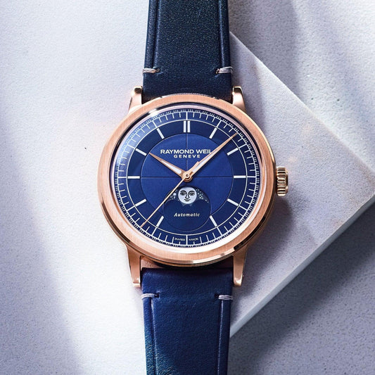RAYMOND WEIL automatic watch with blue moon-phase dial, rose gold-tone case and navy leather strap
